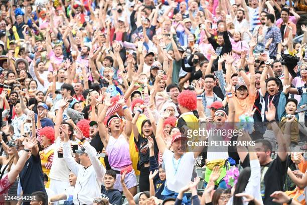 Spectators cheer from the stands on the third day of the Hong Kong Sevens rugby tournament on November 6, 2022.