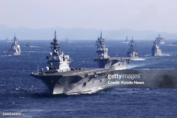 Photo taken by a Kyodo News reporter aboard a Japan Maritime Self-Defense Force helicopter shows vessels taking part in an international fleet review...