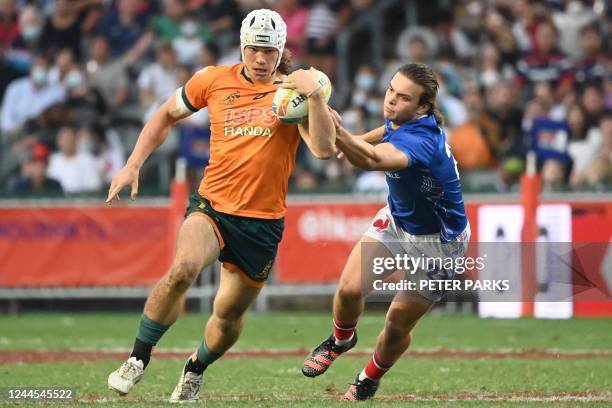 Frances Thomas Carol tackles Australia's Kye Oates in their Cup semi-final match on the third day of the Hong Kong Sevens rugby tournament on...