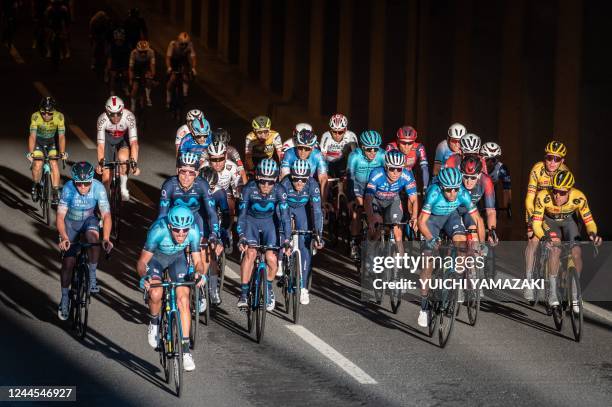 The peloton rides in the streets during the Tour de France Saitama Criterium cycling race in Saitama on November 6, 2022.