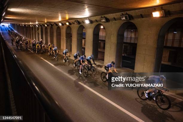 The peloton rides in the streets during the Tour de France Saitama Criterium cycling race in Saitama on November 6, 2022.