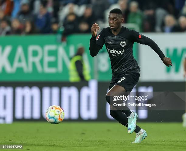 Randal Kolo Muani of Eintracht Frankfurt controls the ball during the Bundesliga match between FC Augsburg and Eintracht Frankfurt at WWK-Arena on...