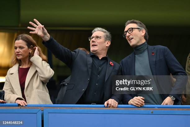 Britain's main opposition Labour Party leader Keir Starmer and his wife Victoria watch from the stands ahead of the English Premier League football...