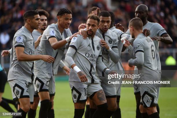 Paris Saint-Germain's Brazilian forward Neymar is congratulated by Paris Saint-Germain's French forward Hugo Ekitike and Paris Saint-Germain's French...