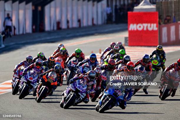 Riders take the start of the Valencia MotoGP Grand Prix race at the Ricardo Tormo racetrack in Cheste, near Valencia, on November 6, 2022.