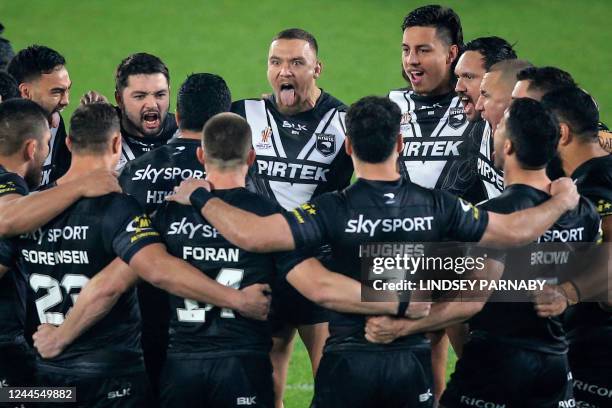 New Zealand players form a group huddle before the start of the 2021 rugby league World Cup men's Quarter Final match between New Zealand and Fiji at...