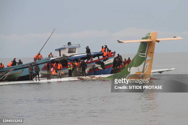 Rescuers search for survivors after a Precision Air flight that was carrying 43 people plunged into Lake Victoria as it attempted to land in the...