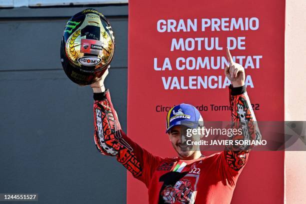 Ducati Italian rider Francesco Bagnaia celebrates as he won the World Championship's title after the Valencia MotoGP Grand Prix race at the Ricardo...