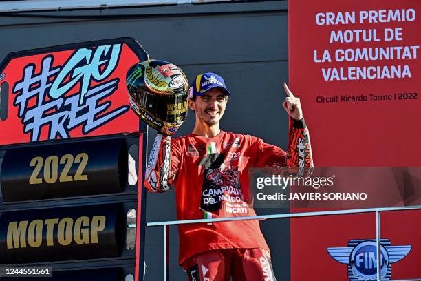 Ducati Italian rider Francesco Bagnaia celebrates as he won the World Championship's title after the Valencia MotoGP Grand Prix race at the Ricardo...