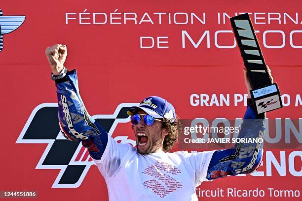 Suzuki Spanish rider Alex Rins celebrates after winning the Valencia MotoGP Grand Prix race at the Ricardo Tormo racetrack in Cheste, near Valencia,...