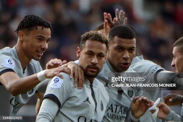 Paris Saint-Germain's Brazilian forward Neymar is congratulated by Paris Saint-Germain's French forward Hugo Ekitike and Paris Saint-Germain's French...
