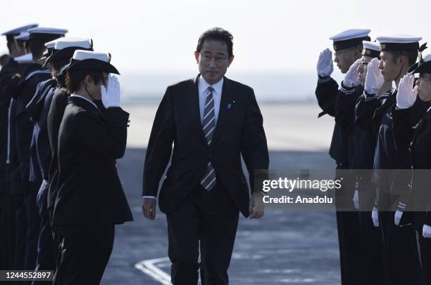 Japan's Prime Minister Fumio Kishida receives salutes from Japan Maritime Self-Defence Force âs soldiers during an International Fleet Review...