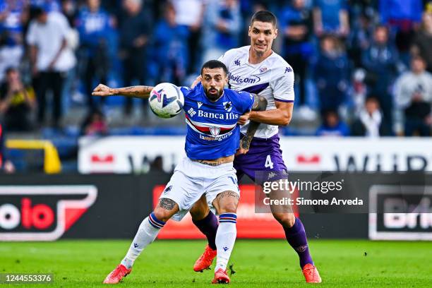 Francesco Caputo of Sampdoria and Nikola Milenkovic of Fiorentina vie for the ball during the Serie A match between UC Sampdoria and ACF Fiorentina...