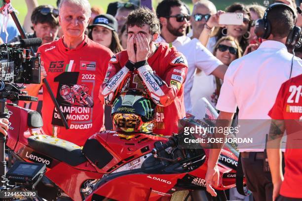 Ducati Italian rider Francesco Bagnaia celebrates as he won the World Championship's title after the Valencia MotoGP Grand Prix race at the Ricardo...