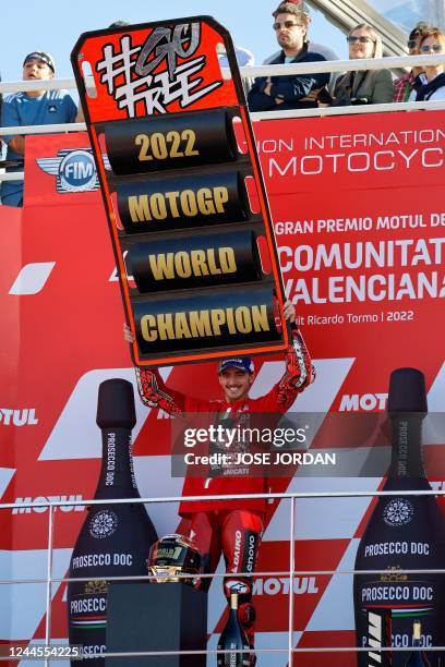 Ducati Italian rider Francesco Bagnaia celebrates as he won the World Championship's title after the Valencia MotoGP Grand Prix race at the Ricardo...