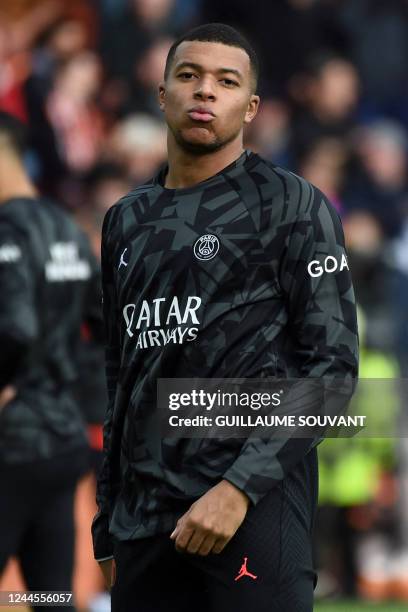 Paris Saint-Germain' French forward Kylian Mbappe looks on before the French L1 football match between FC Lorient and Paris Saint Germain at Stade du...