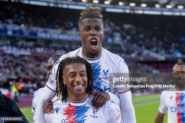 Michael Olise of Crystal Palace celebrates with Wilfried Zaha after scoring goal during the Premier League match between West Ham United and Crystal...