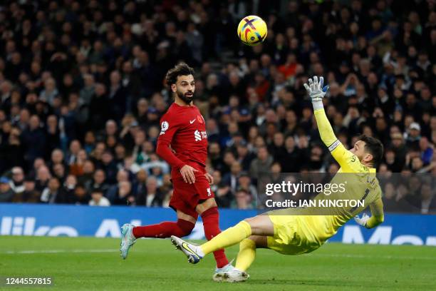 Liverpool's Egyptian striker Mohamed Salah scores his team's second goal past Tottenham Hotspur's French goalkeeper Hugo Lloris during the English...