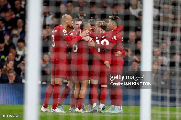 Liverpool players celebrate their second goal during the English Premier League football match between Tottenham Hotspur and Liverpool at Tottenham...