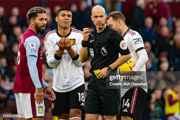 Casemiro of Manchester United reacts to Referee Anthony Taylor during the Premier League match between Aston Villa and Manchester United at Villa...