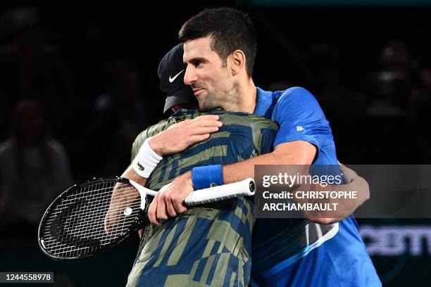 Denmark's Holger Rune shakes hands with Serbia's Novak Djokovic after winning at the end of their men's singles final tennis match on day 7 of the...