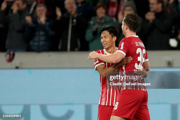 Wooyeong Jeong of SC Freiburg and Michael Gregoritsch of SC Freiburg celebrates after scoring his team's second goal with teammates during the...