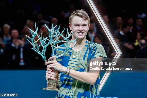 Holger Nodskov Rune of Denmark celebrates victory after his match against Novak Djokovic of Serbia during the Day Seven of Rolex Paris Masters at...