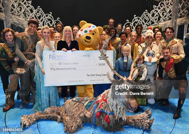 Sara Cox and the cast of Frozen The Musical present Pudsey the Bear with a check for £50,000 following the Gala Performance of "Frozen The Musical"...