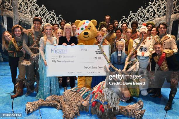 Sara Cox and the cast of Frozen The Musical present Pudsey the Bear with a check for £50,000 following the Gala Performance of "Frozen The Musical"...