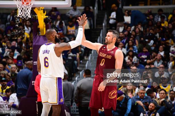 LeBron James of the Los Angeles Lakers high fives Kevin Love of the Cleveland Cavaliers during the game on November 6, 2022 at Crypto.Com Arena in...