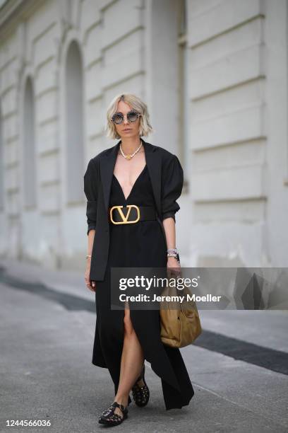 Karin Teigl wearing Valentino belt, by Aylin Koenig dress, Zara blazer, Gucci sandals and shades and Bottega Veneta bag on May 31, 2020 in Augsburg,...