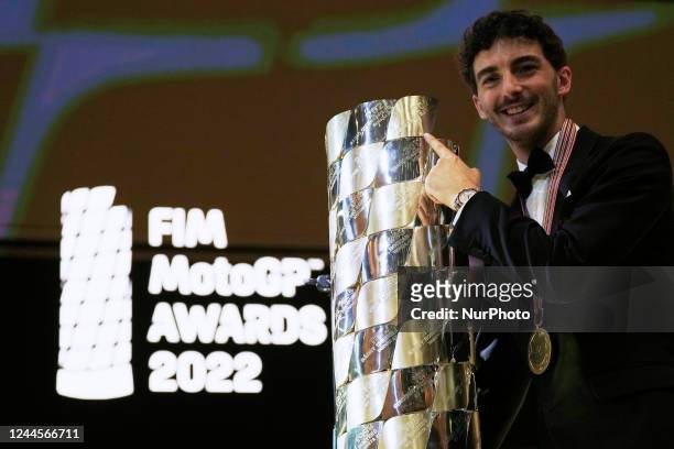 Francesco &quot;Pecco&quot; Bagnaia of Italy and Ducati Lenovo Team poses with the champion trophy during the FIM Awards Ceremony after the Gran...
