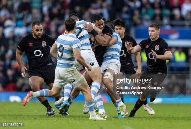 Joe Cokanasiga of England is tackled by Jeronimo De La Fuente of Argentina during the Autumn International match between England and Argentina at...