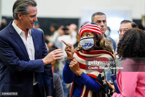 Long Beach, CA, Sunday, November 6, 2022 Dr. Jennifer Robinson chats with California Governor Gavin Newsom at a rally endorsing ballot proposition 1...