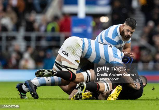 Jonny Hill of England is tackled by Tomas Lavanini of Argentina during the Autumn International match between England and Argentina at Twickenham...