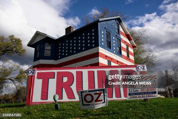 Campaign signs are seen in front of the "Trump House", created and owned by Pennsylvania State Rep. Leslie Rossi in 2016, in Youngstown, Pennsylvania...