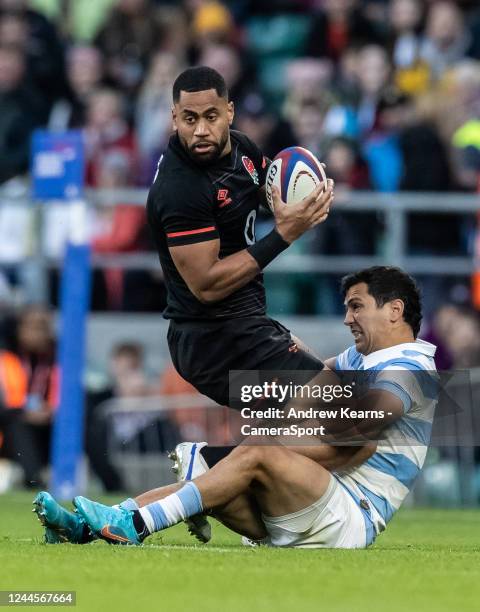 Joe Cokanasiga of England is tackled by Matias Moroni of Argentina during the Autumn International match between England and Argentina at Twickenham...