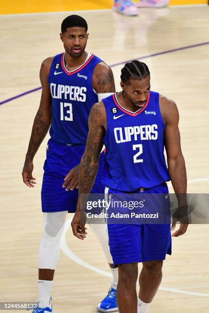 Paul George and Kawhi Leonard of the LA Clippers walk on to the court during the game against the Los Angeles Lakers on October 20, 2022 at...