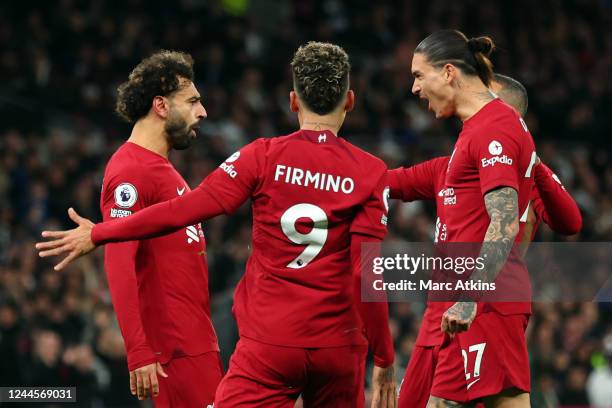 Mohamed Salah of Liverpool celebrates scoring his 1st goal with Roberto Firmino and Darwin Nunez during the Premier League match between Tottenham...