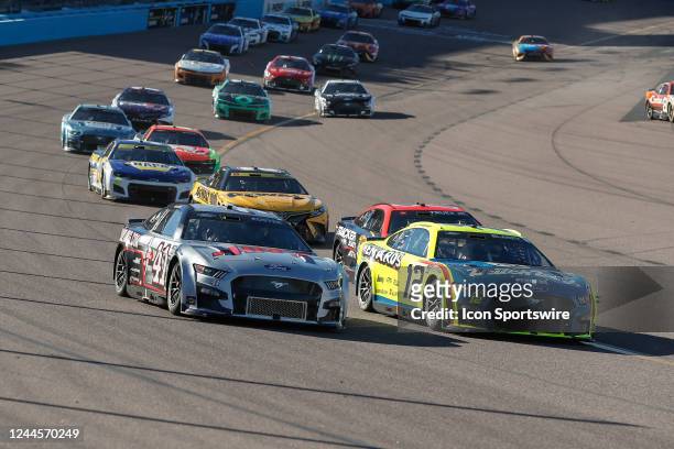 Cole Custer and Ryan Blaney race side by side during the NASCAR Cup Series Championship Race on November 6, 2022 at Phoenix Raceway in Avondale,...