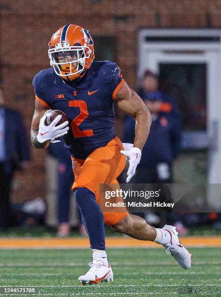 Chase Brown of the Illinois Fighting Illini runs the ball during the game against the Michigan State Spartans at Memorial Stadium on November 5, 2022...