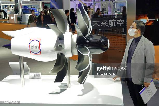 This photo taken on November 5, 2022 shows an aircraft engine model on display at the General Electric stand during the 5th China International...