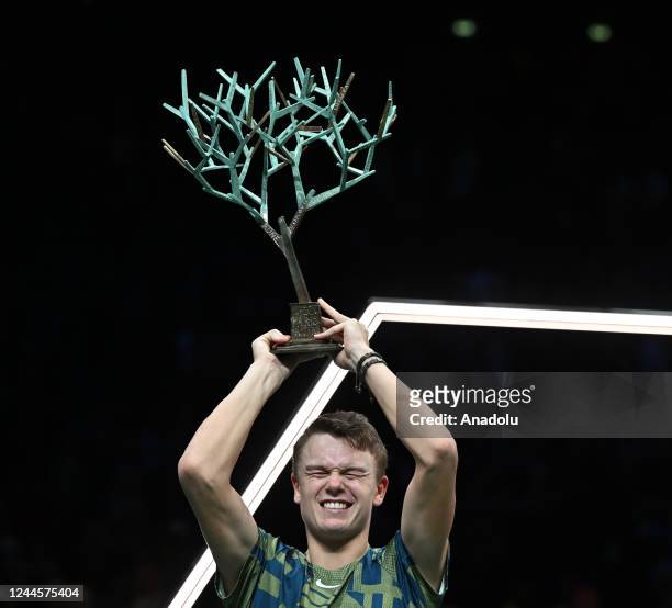 Holger Rune of Denmark poses with winner trophy after the match against Novak Djokovic of Serbia during their men's singles final at the ATP World...