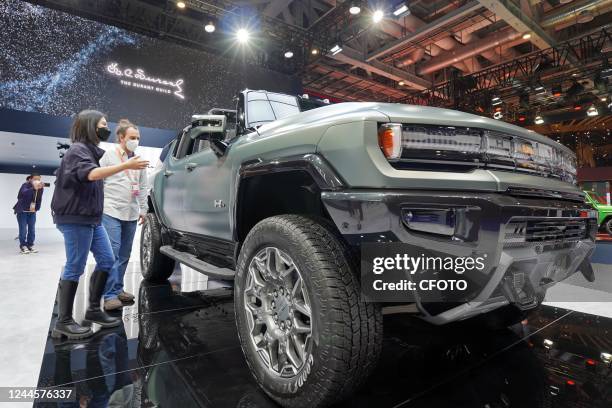 Visitors view a Hummer EV pure electric SUV at the 5th China International Import Expo in Shanghai, China, November 7, 2022.