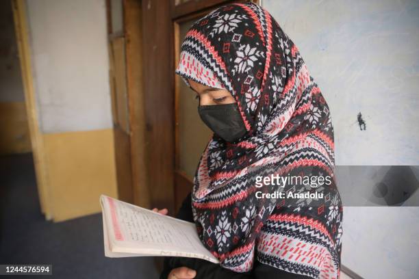 Child studies at the school as Afghan volunteer sisters, Sodabe Nezend and Azita Nezend educate Afghan girls of middle and high school ages who are...