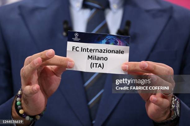 Champions League's ambassador Turkish former footballer Hamit Altintop shows the paper slip of Inter Milan during the draw for the round of 16 of the...