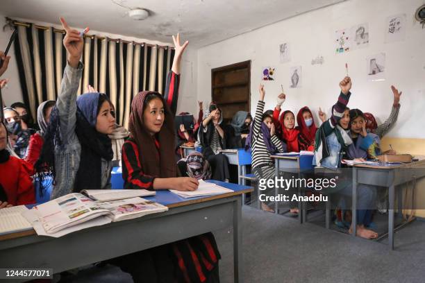 Children study at the school as Afghan volunteer sisters, Sodabe Nezend and Azita Nezend educate Afghan girls of middle and high school ages who are...
