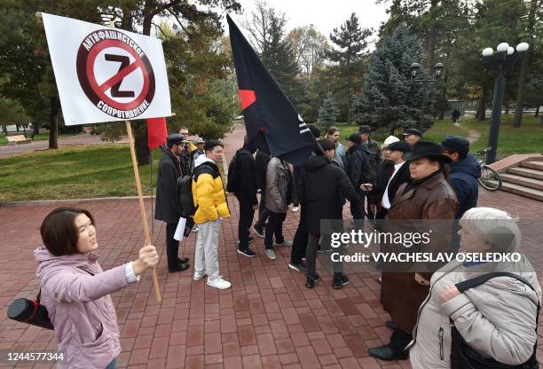 Kyrgyz Communist party supporters clash with the youth Marxist organization 'KyrgyzSots', which opposes the war in Ukraine, near a monument to the...