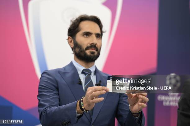 Special guest Hamit Altintop draws out the card of Liverpool FC during the UEFA Champions League 2022/23 Round of 16 draw at the UEFA Headquarters,...