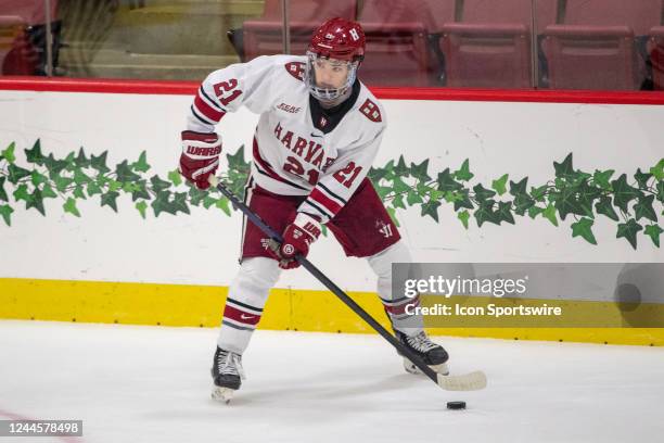 Harvard Crimson forward Sean Farrell passes the puck during a college hockey game between the Brown Bears and the Harvard Crimson on November 4 at...